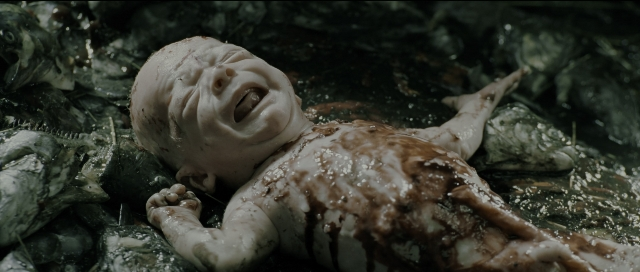 Wide shot frame from Perfume: The Story of a Murderer — bed, person, human face