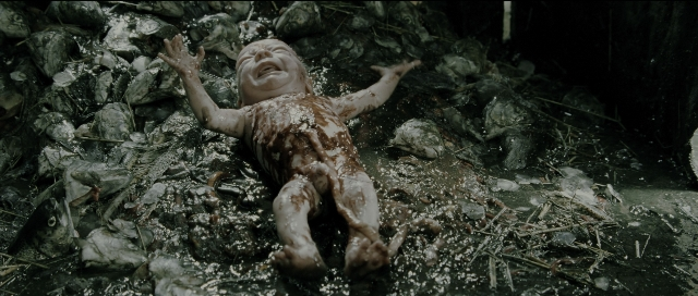 Wide shot frame from Perfume: The Story of a Murderer — bed, person, human face