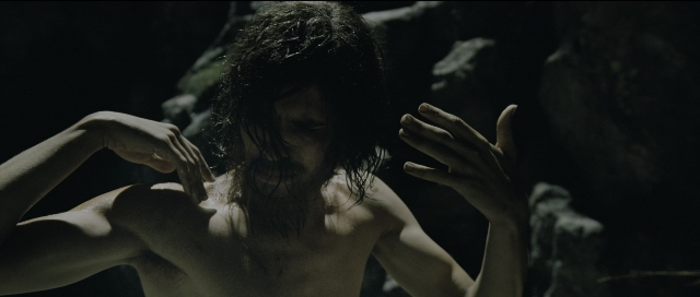 Medium shot frame from Perfume: The Story of a Murderer — standing, beard, face