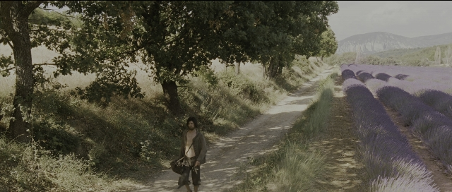 Wide shot frame from Perfume: The Story of a Murderer — walking, coat, bag