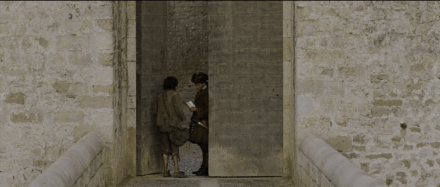 Wide shot frame from Perfume: The Story of a Murderer — book, standing, door