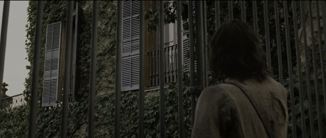 Wide shot frame from Perfume: The Story of a Murderer — standing, coat, hair