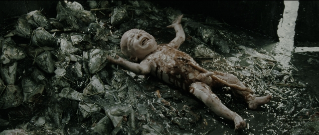 Wide shot frame from Perfume: The Story of a Murderer — bed, person, human face