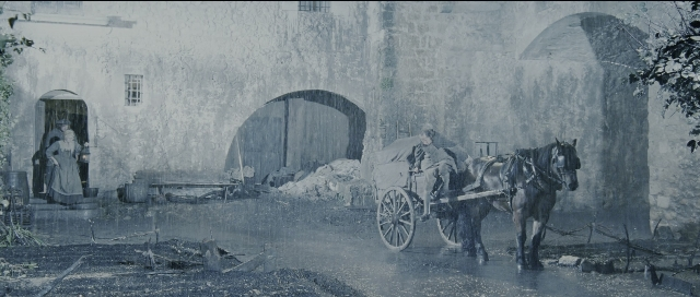 Wide shot frame from Perfume: The Story of a Murderer — sitting, door, horse