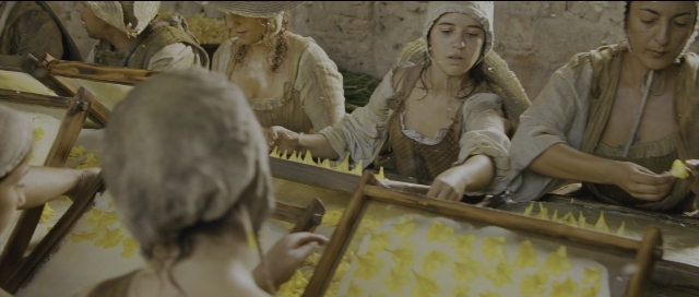 Wide shot frame from Perfume: The Story of a Murderer — sitting, table, person