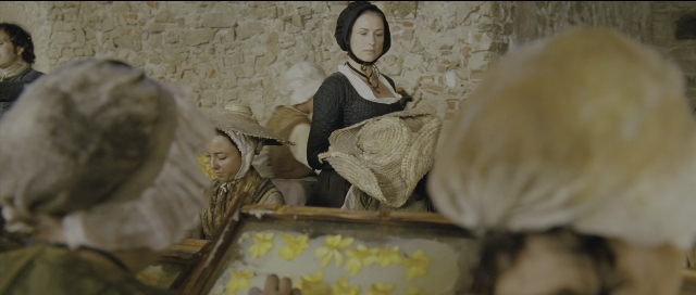 Wide shot frame from Perfume: The Story of a Murderer — sitting, standing, room