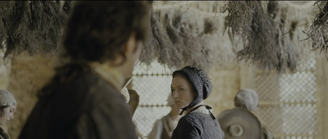 Wide shot frame from Perfume: The Story of a Murderer — standing, room, dress