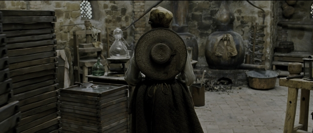 Wide shot frame from Perfume: The Story of a Murderer — standing, room, table