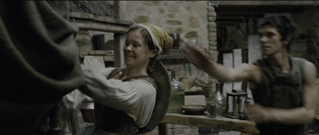 Wide shot frame from Perfume: The Story of a Murderer — standing, table, kitchen