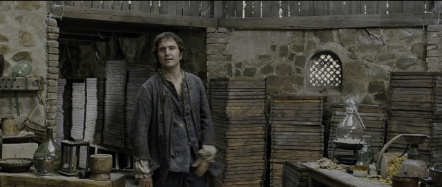 Wide shot frame from Perfume: The Story of a Murderer — standing, room, table