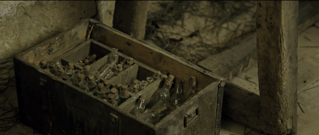 Wide shot frame from Perfume: The Story of a Murderer — room, glass, box