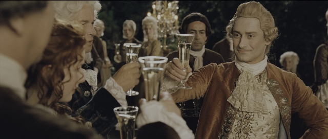 Wide shot frame from Perfume: The Story of a Murderer — table, coat, hand