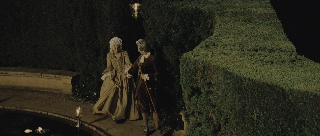Wide shot frame from Perfume: The Story of a Murderer — standing, dialogue, hat