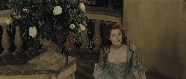 Wide shot frame from Perfume: The Story of a Murderer — sitting, dress, face