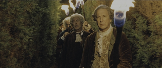 Wide shot frame from Perfume: The Story of a Murderer — standing, coat, forest