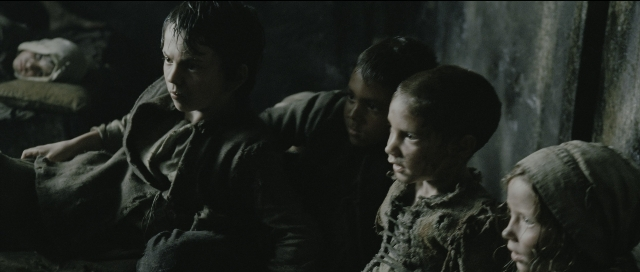 Wide shot frame from Perfume: The Story of a Murderer — sitting, standing, room