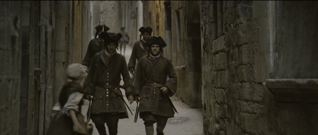 Wide shot frame from Perfume: The Story of a Murderer — walking, coat, person