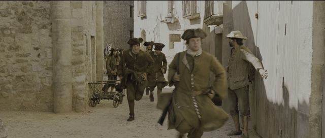 Wide shot frame from Perfume: The Story of a Murderer — walking, street, hat