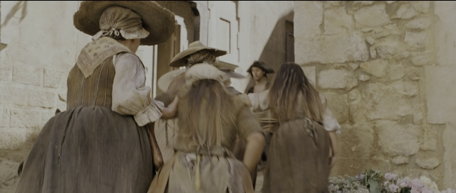 Wide shot frame from Perfume: The Story of a Murderer — walking, street, person
