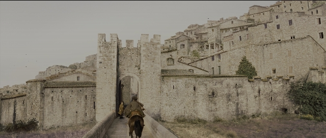 Wide shot frame from Perfume: The Story of a Murderer — castle, person