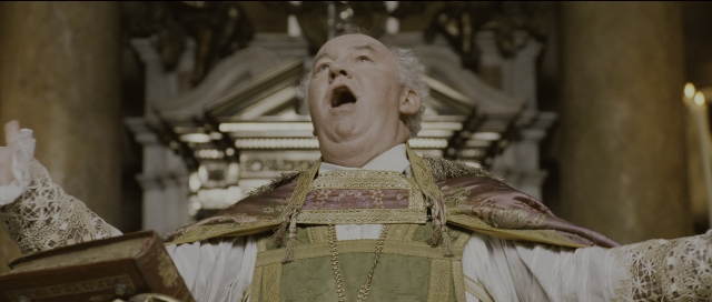 Wide shot frame from Perfume: The Story of a Murderer — book, standing, hand
