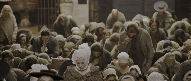 Wide shot frame from Perfume: The Story of a Murderer — dialogue, street, person