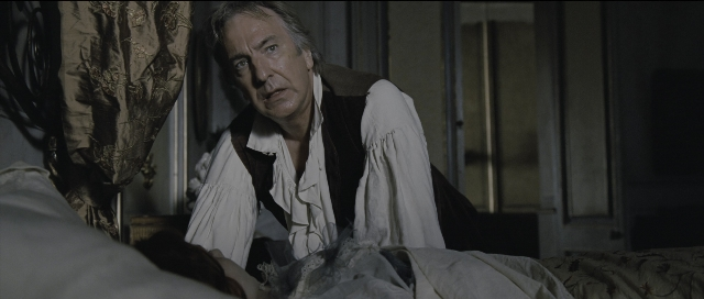 Wide shot frame from Perfume: The Story of a Murderer — sitting, room, bed