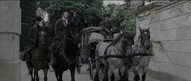 Wide shot frame from Perfume: The Story of a Murderer — walking, street, hat