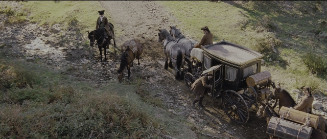 Wide shot frame from Perfume: The Story of a Murderer — sitting, street, horse