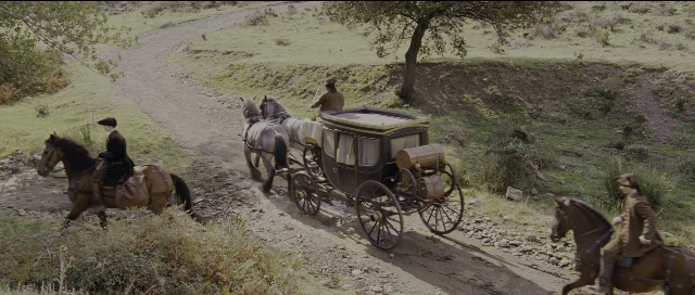 Wide shot frame from Perfume: The Story of a Murderer — sitting, walking, street
