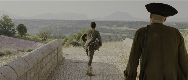 Wide shot frame from Perfume: The Story of a Murderer — walking, coat, person