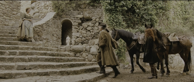 Wide shot frame from Perfume: The Story of a Murderer — standing, walking, hat