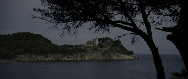 Wide shot frame from Perfume: The Story of a Murderer — water, castle, sea