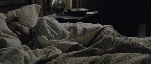 Wide shot frame from Perfume: The Story of a Murderer — room, table, bed