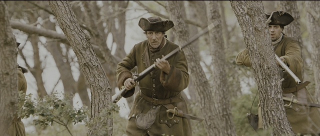 Medium shot frame from Perfume: The Story of a Murderer — standing, hat, coat