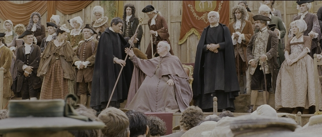 Wide shot frame from Perfume: The Story of a Murderer — standing, hat, coat