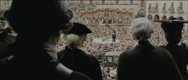 Wide shot frame from Perfume: The Story of a Murderer — suit, tie, hair