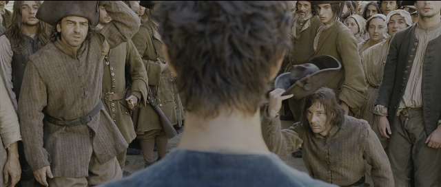 Wide shot frame from Perfume: The Story of a Murderer — standing, room, dialogue