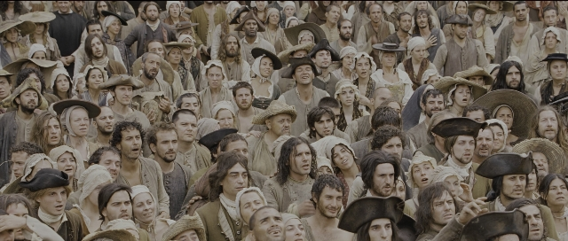 Wide shot frame from Perfume: The Story of a Murderer — sitting, standing, person