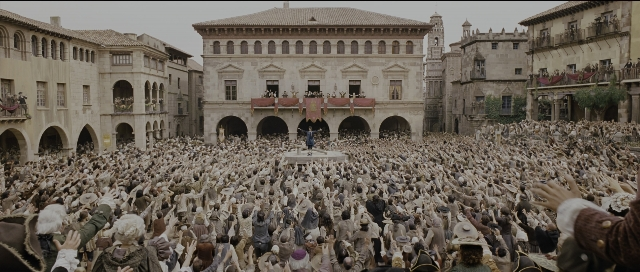 Wide shot frame from Perfume: The Story of a Murderer — sitting, standing, person