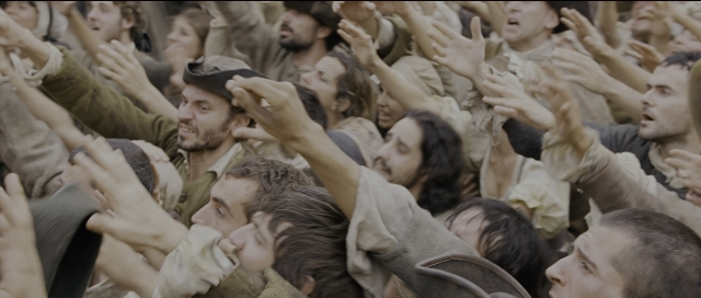 Wide shot frame from Perfume: The Story of a Murderer — person, human face, human hand