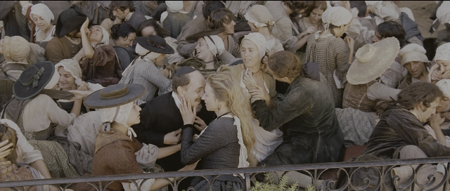 Wide shot frame from Perfume: The Story of a Murderer — kiss, hug, hair
