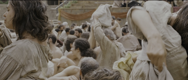 Wide shot frame from Perfume: The Story of a Murderer — sitting, standing, room