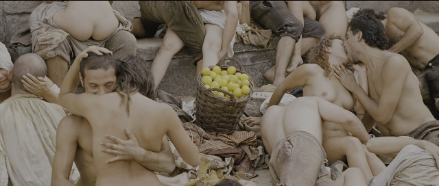 Wide shot frame from Perfume: The Story of a Murderer — sitting, standing, person