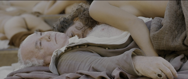 Wide shot frame from Perfume: The Story of a Murderer — bed, shirt, bedroom