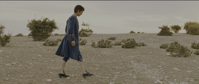 Wide shot frame from Perfume: The Story of a Murderer — walking, coat, person