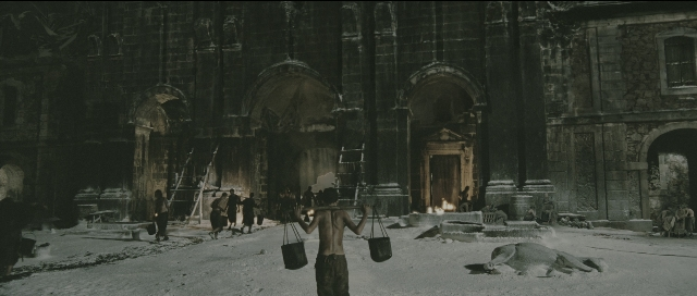 Wide shot frame from Perfume: The Story of a Murderer — standing, snow, person