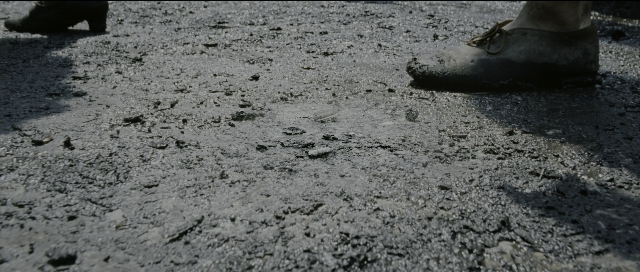 Wide shot frame from Perfume: The Story of a Murderer — standing, footwear