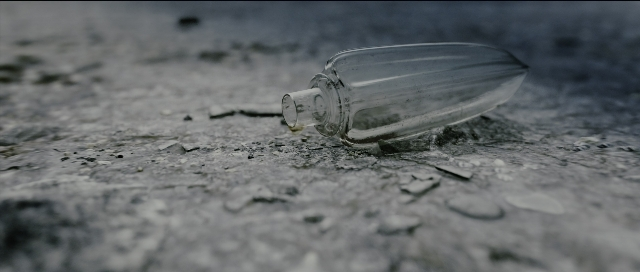 Frame from Perfume: The Story of a Murderer — water, bottle, glass