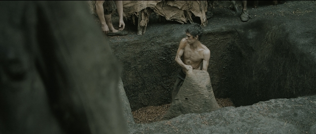 Wide shot frame from Perfume: The Story of a Murderer — standing, person, human face